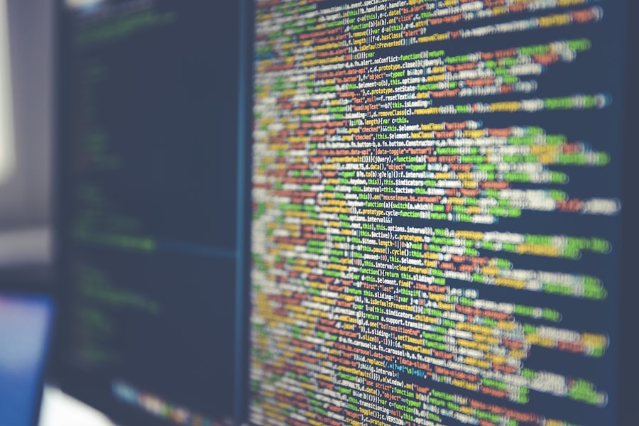 Colorful programming code reflected across a screen.
