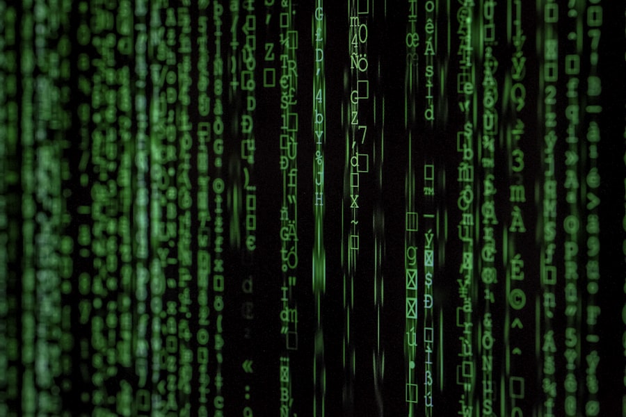 Green code and symbols on a dark monitor.